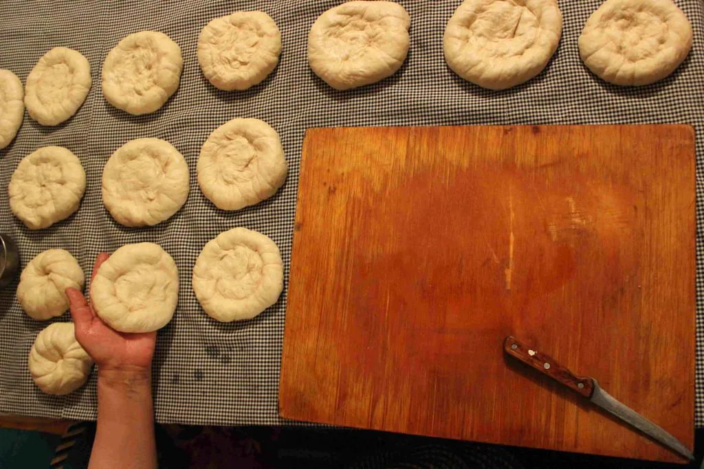 Shaping kulcha with a knife